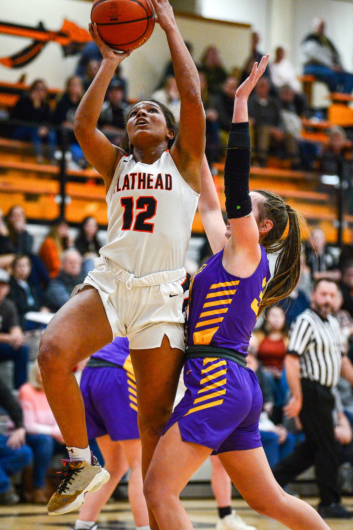 Flathead's Akilah Kubi (12) drives to the basket in the first half against Missoula Sentinel at Flathead High School on Friday, Jan. 6. (Casey Kreider/Daily Inter Lake)