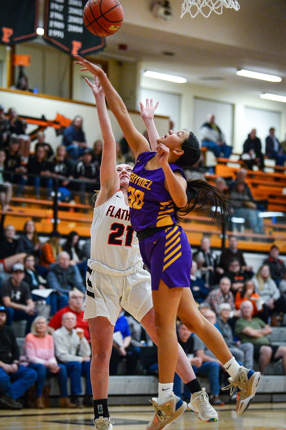 Missoula Sentinel's Kaitlyn Hammett (30) blocks a shot by Flathead's Harlie Roth (21) in the first half at Flathead High School on Friday, Jan. 6. (Casey Kreider/Daily Inter Lake)