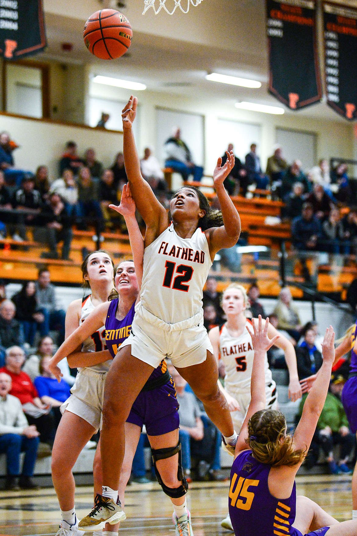 Flathead's Akilah Kubi (12) drives to the basket in the first half against Missoula Sentinel at Flathead High School on Friday, Jan. 6. (Casey Kreider/Daily Inter Lake)