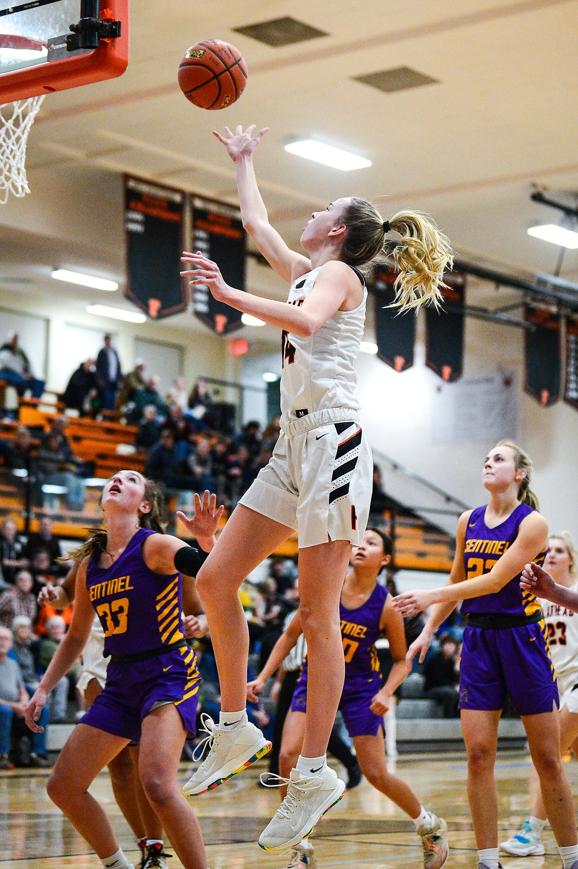 Flathead's Kennedy Moore (14) drives to the basket in the first half against Missoula Sentinel at Flathead High School on Friday, Jan. 6. (Casey Kreider/Daily Inter Lake)