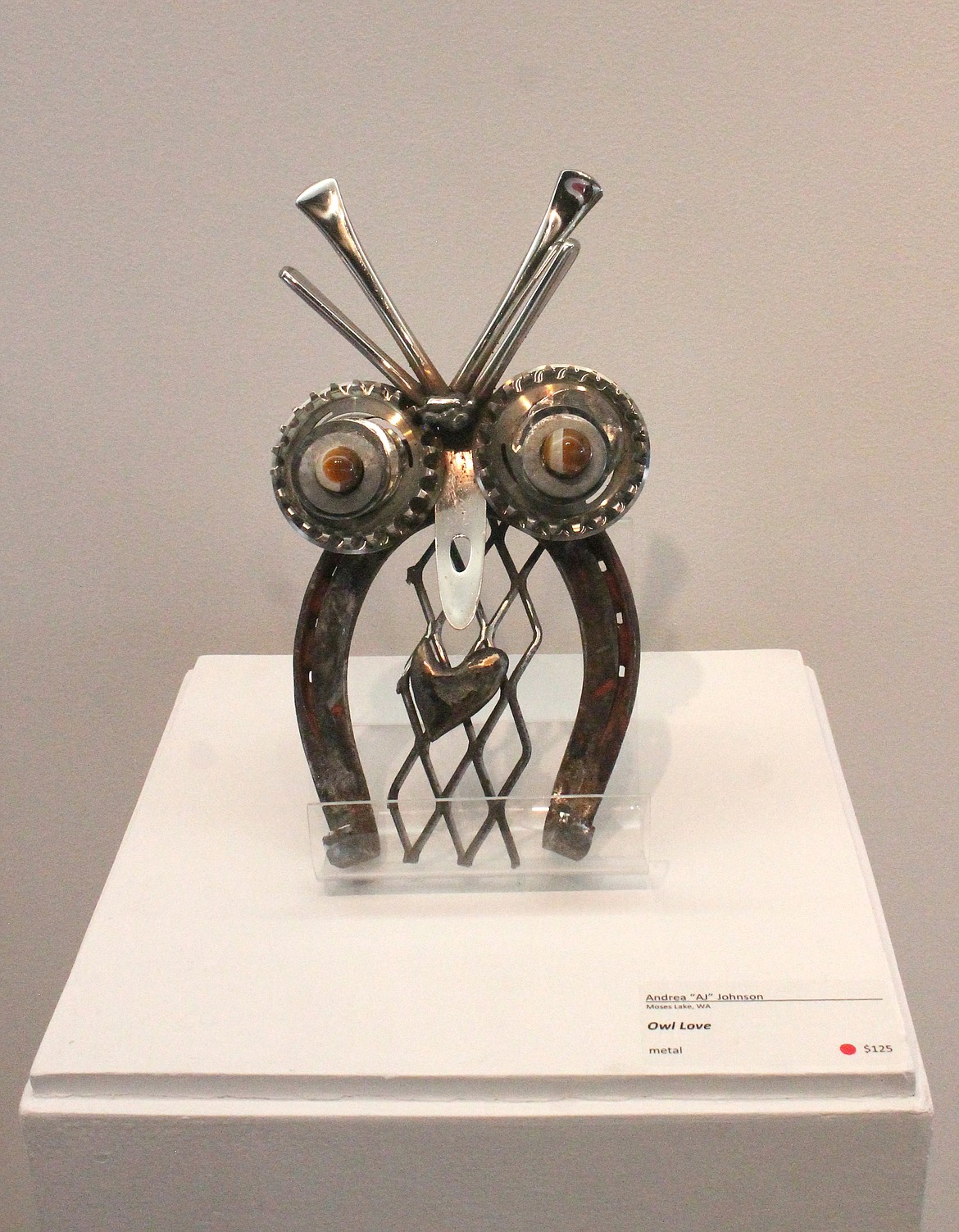 The welded sculpture “Owl Love,” by Andrea “AJ” Johnson, was made from bits of metal the artist acquired here and there, centered around a horseshoe.