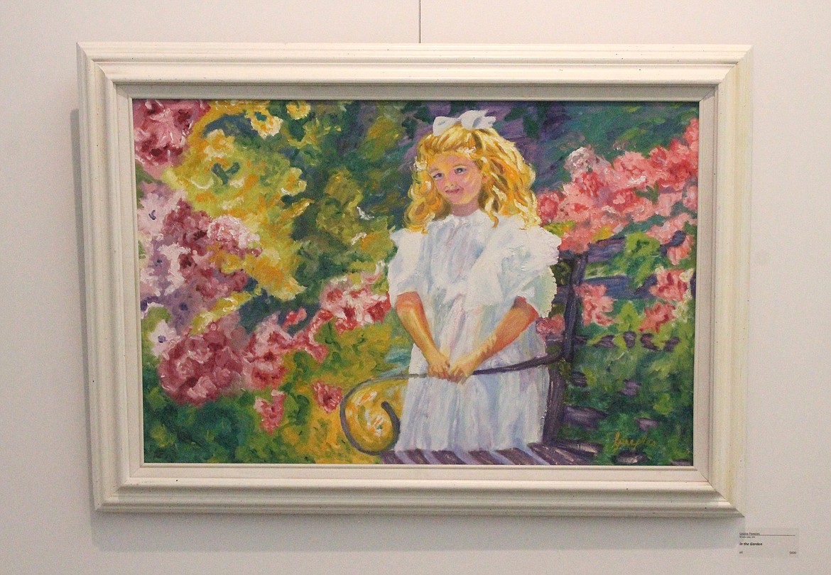 “In the Garden,” an oil portrait by Louise Peeples of Moses Lake, is one of the artworks on display at the Moses Lake Museum & Art Gallery.