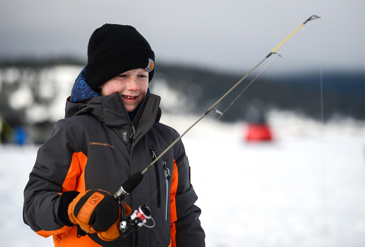 Rowen Parsons waits for a bite at the Sunriser Lions Family Ice Fishing Derby at Smith Lake in Kila on Saturday, Jan. 7. (Casey Kreider/Daily Inter Lake)