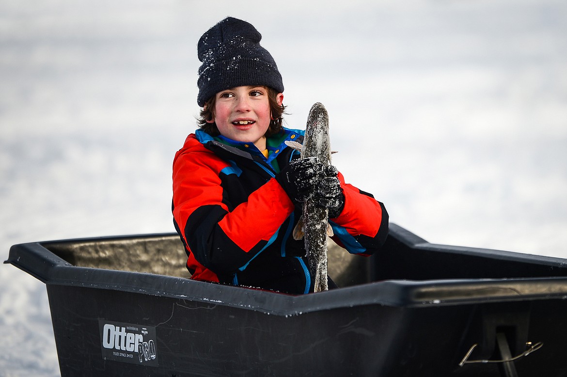 Nolan Kientz holds a pike caught at the Sunriser Lions Family Ice Fishing Derby at Smith Lake in Kila on Saturday, Jan. 7. (Casey Kreider/Daily Inter Lake)