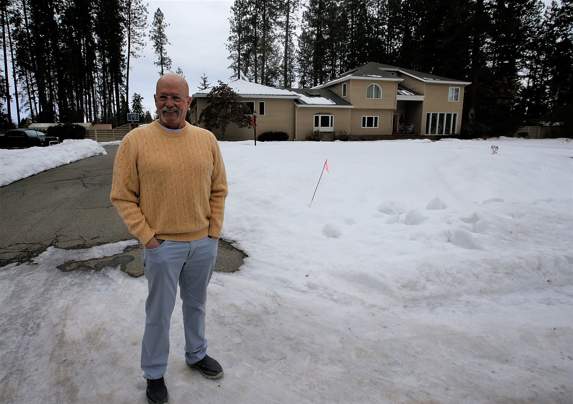 Don Schmitt stands in front of his home on Arrowhead Road on Thursday.