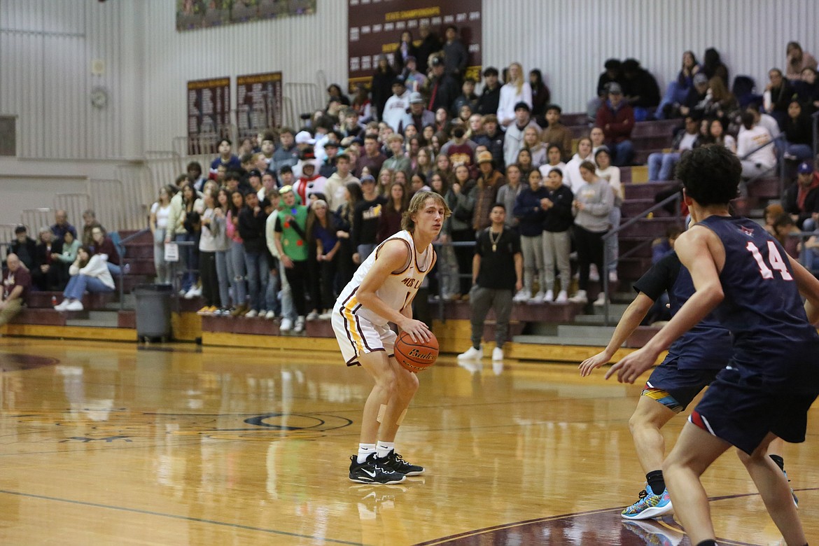 Moses Lake freshman Brady Jay looks for a teammate to pass the ball to in the first half of the Maverick’s 59-54 win over Eisenhower.