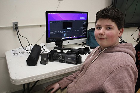 Working on a Bear Aware documentary with the ROXY Theater in Missoula, 7th grade student Mike Powell uploads a file. The International Wildlife Film Festival in the ROXY has been a key partner with Alberton School on wildlife film projects. (Photo provided)