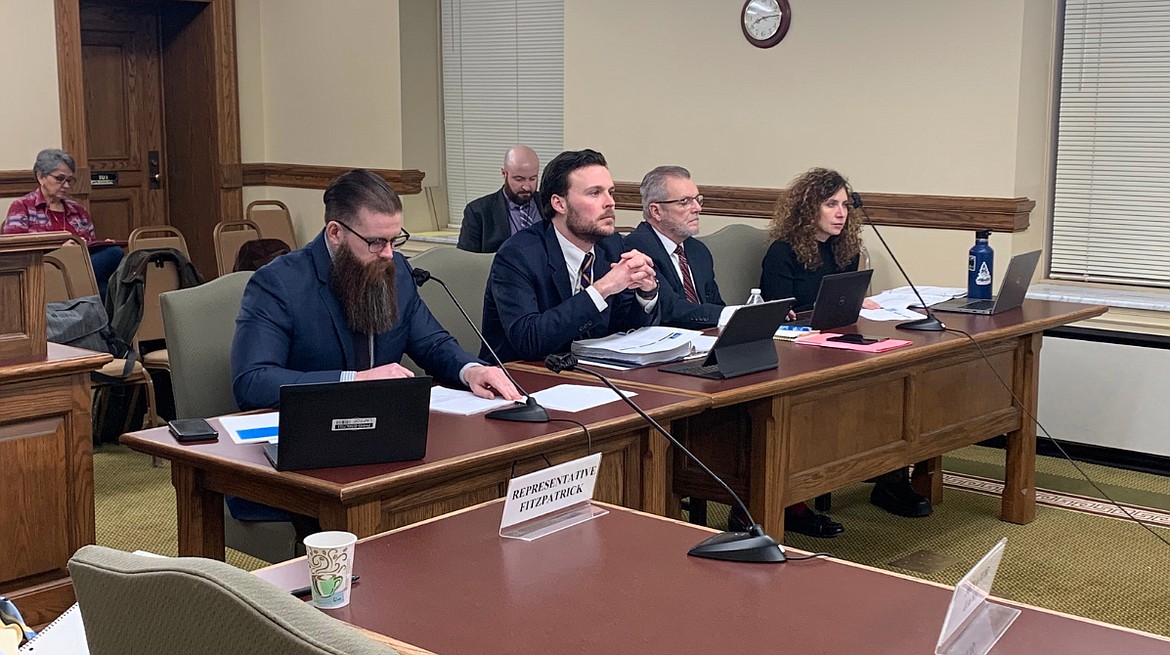 Montana Department of Public Health and Human Services Director Charlie Brereton, center, appears with staff members before lawmakers on Thursday, Jan. 5, 2023. (Mara Silvers/MTFP)