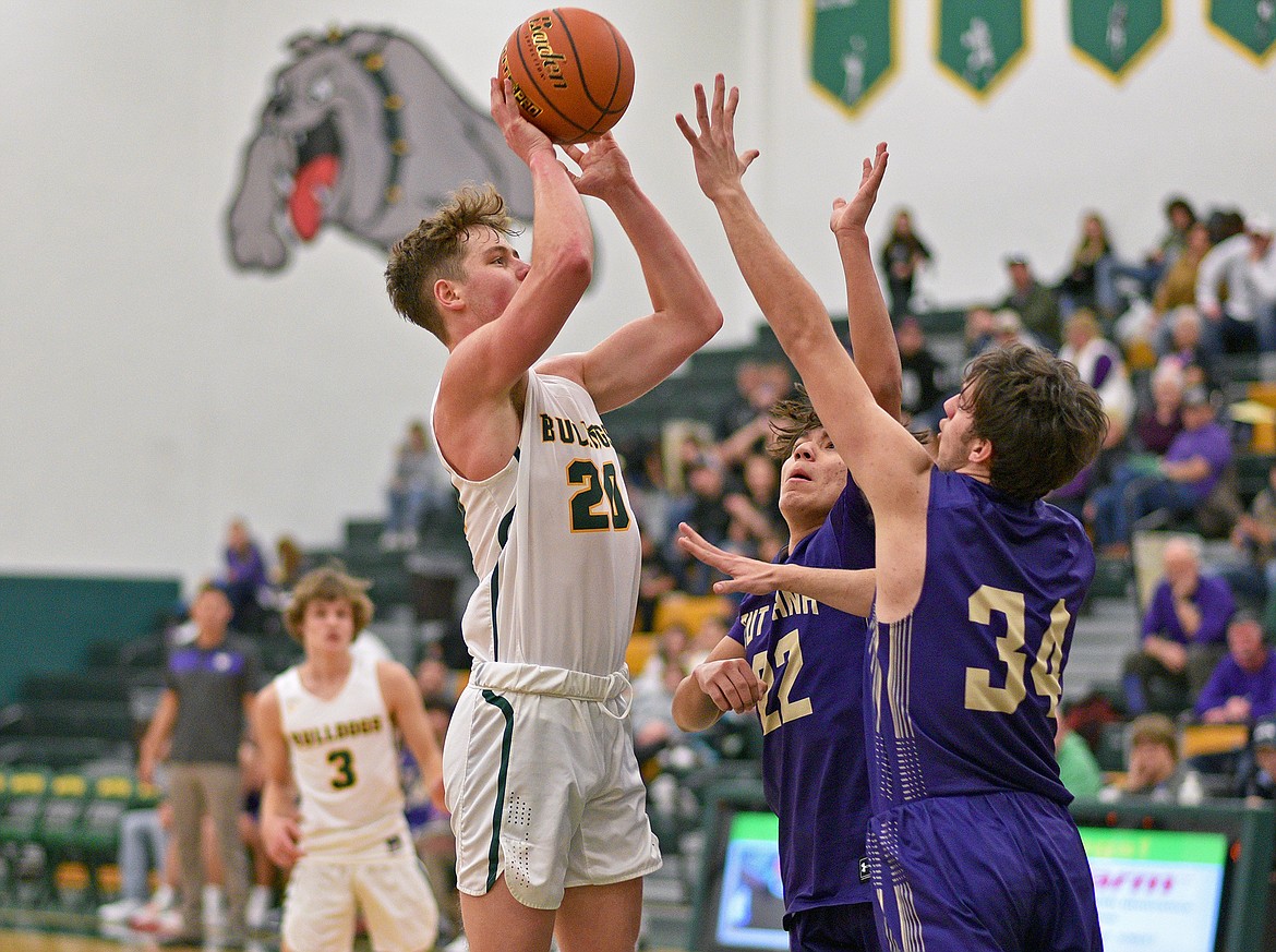 Bulldog Jack Sears pulls up for a jump shot in a game against Cut Bank on Saturday in Whitefish. (Whitney England/Whitefish Pilot)