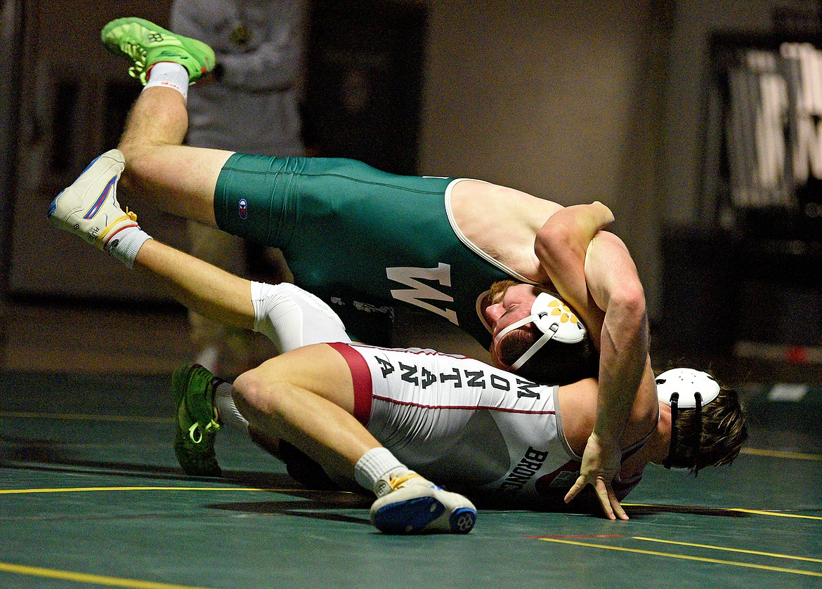 Bulldog Kitar Olsen wrestles Hamilton in a dual on Thursday at Whitefish High School. (Whitney England/Whitefish Pilot)