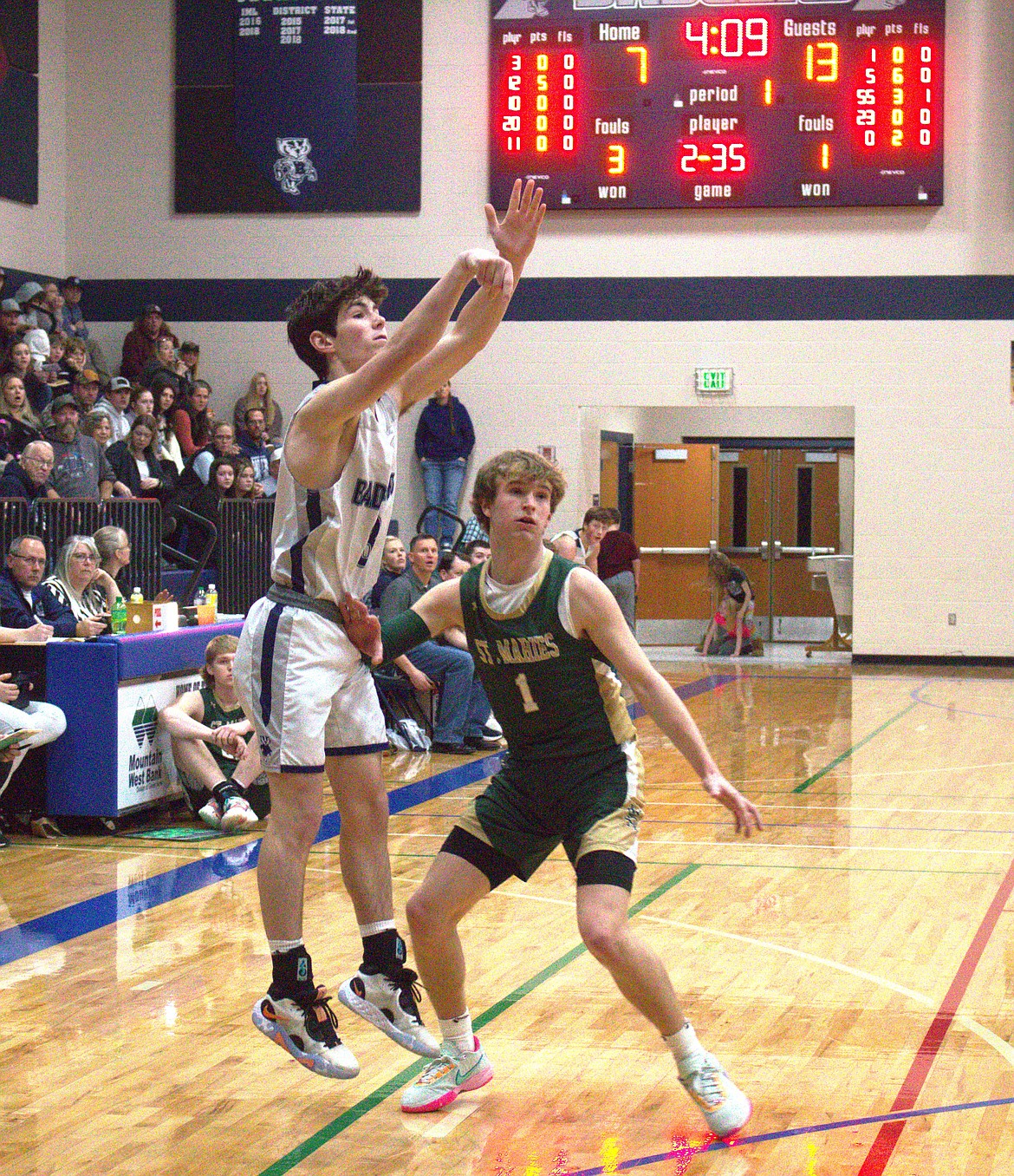 Eli Blackmore makes a three-pointer.