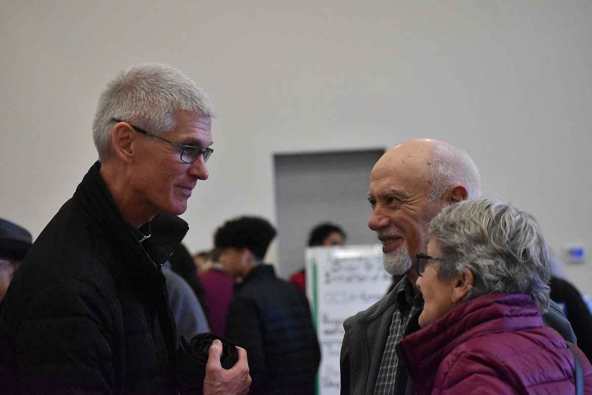 Father Daniel Dufner spoke with attendees of the open house.