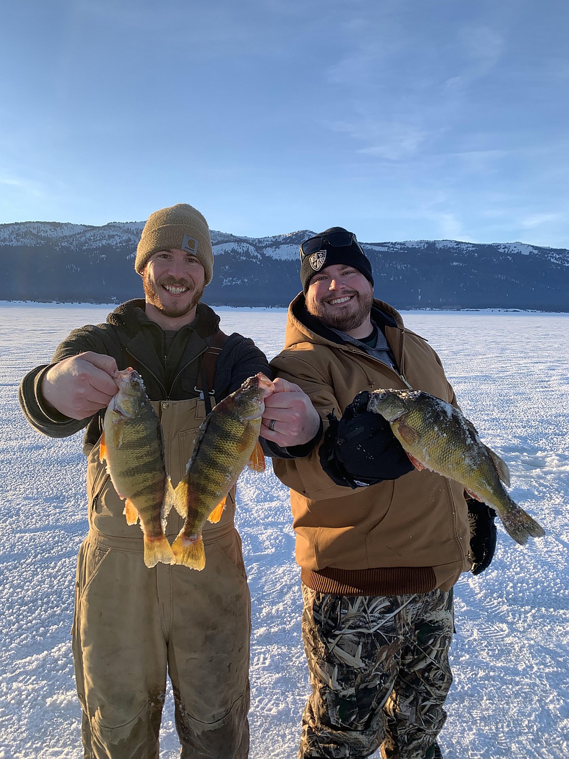 Ice fishermen show off their catch after a recent excursion.