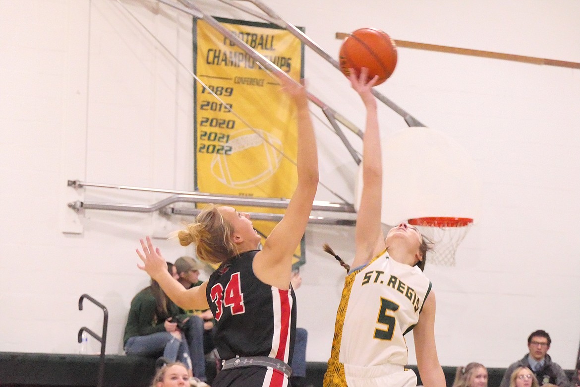 Hot Springs junior Lauryn Aldridge (34) jumps ball with St. Regis' Emma Gillette to open their game this past Thursday in St. Regis.  (Chuck Bandel/VP-MI)