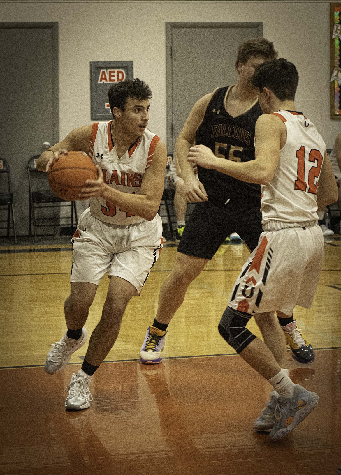 Anaya Loberg looks for room in the lane during their game with Florence-Carlton Saturday night in Plains. (Tracy Scott/Valley Press)