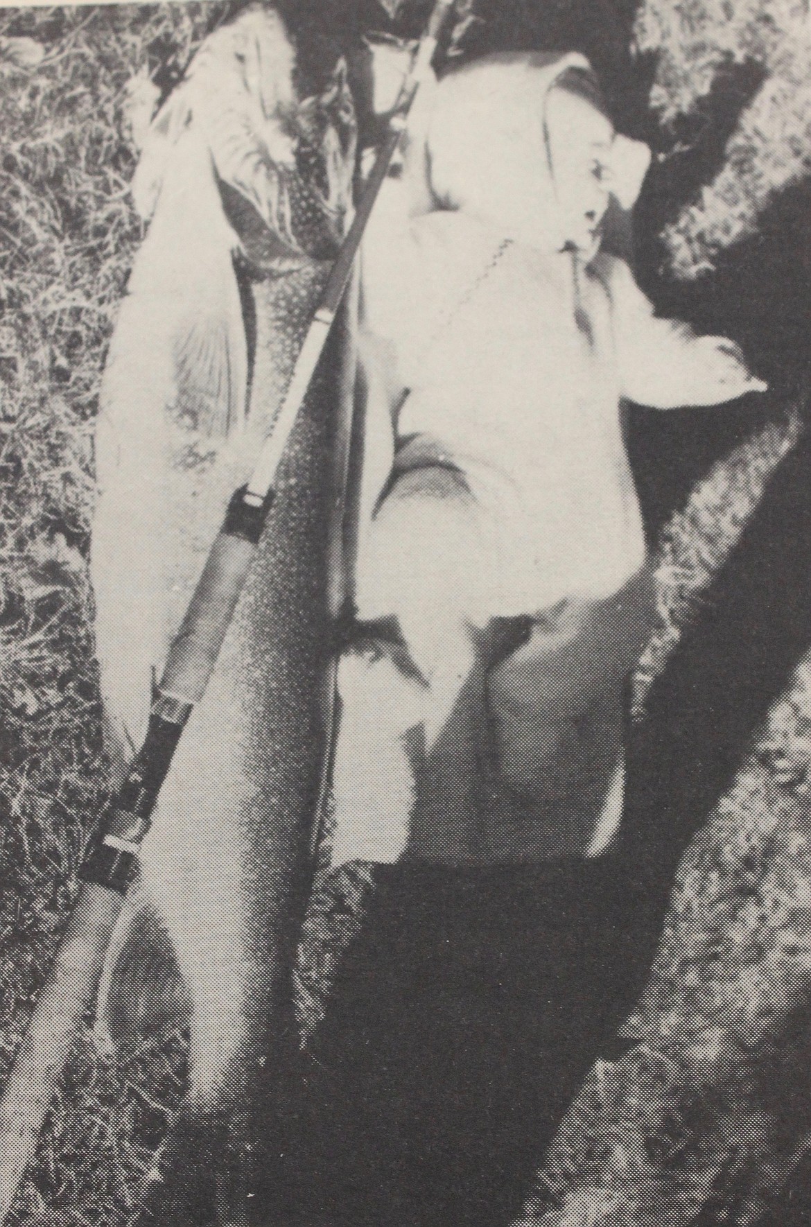 Baby Ryan DeBruin appears slightly disturbed with a fishy friend, and he should be. The Flathead Mack outweighs Ryan by 16 to 18 pounds. (photo courtesy of Ross Dunnigan)