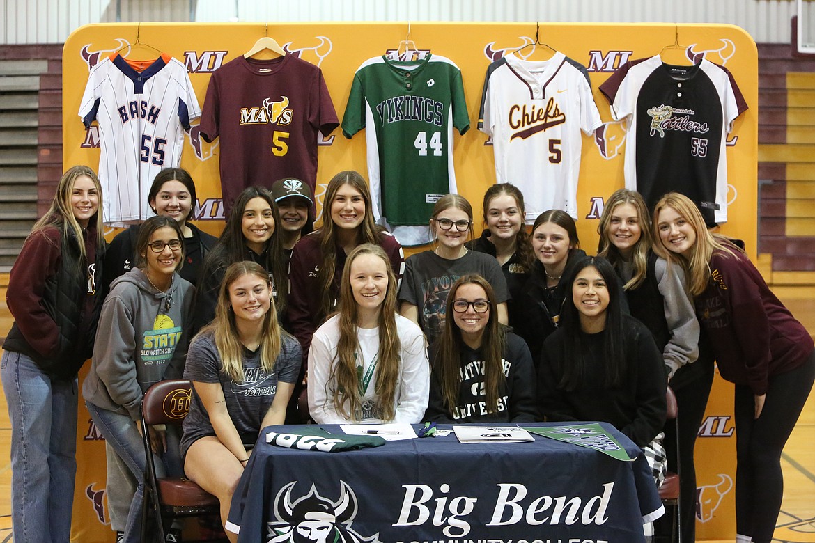 Numerous former teammates pose for photos with Big Bend’s newly-signed softball player Ali Stanley during her signing ceremony on Monday afternoon.