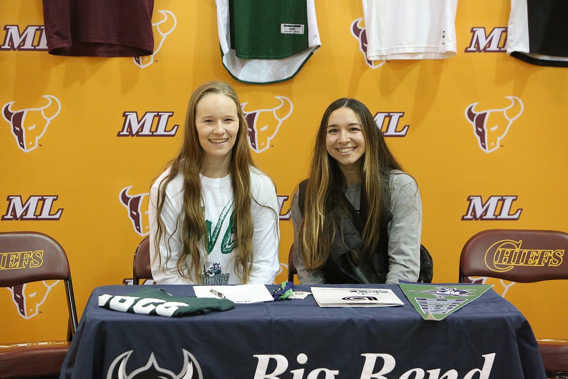Senior Ali Stanley, left, and Big Bend Head Coach Kylee Brulotte, right, smile at Stanley’s signing ceremony on Monday at Moses Lake High School.