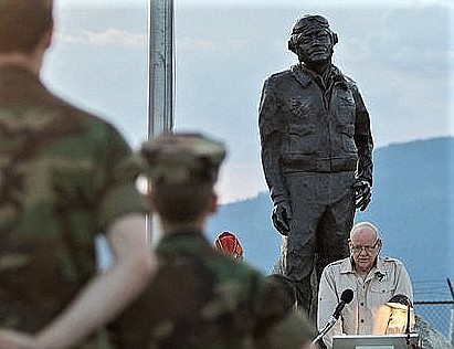 Gregory Boyington Jr. speaks before an 8-foot bronze statue of his father, World War II ace Pappy Boyington.