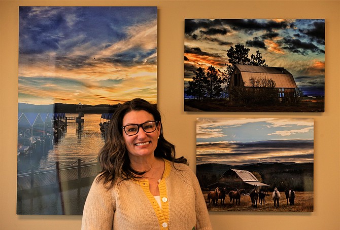 Linda Coppess, president and CEO of the Coeur d'Alene Regional Chamber, stands by art in her office that looks out on Lake Coeur d'Alene.