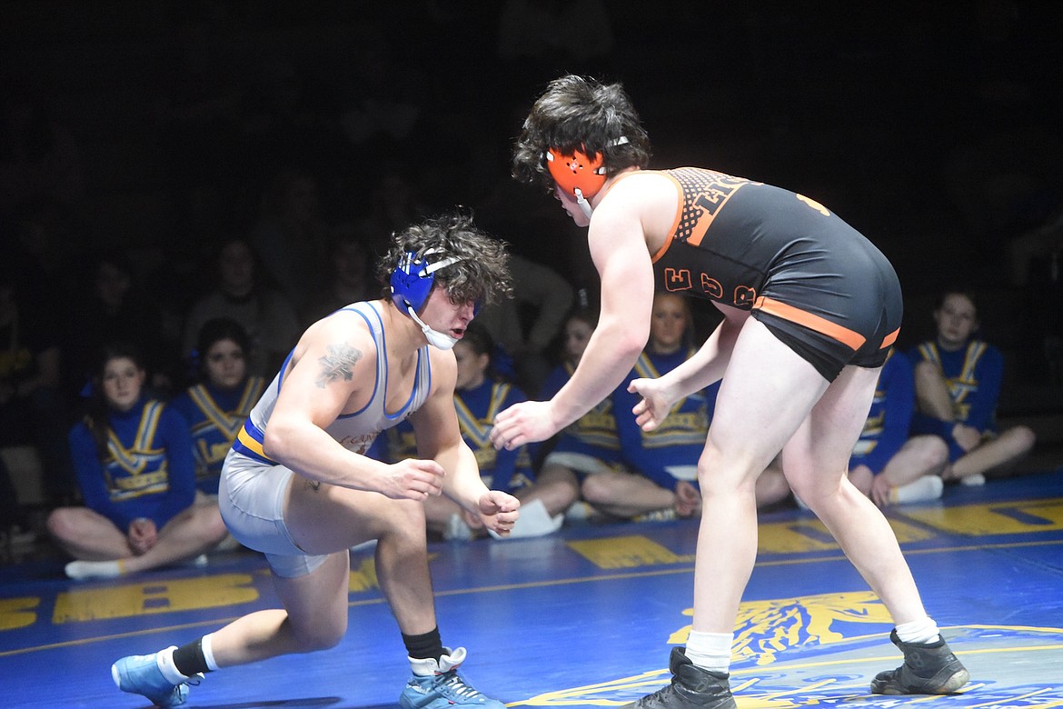 Libby's Jace DeShazer tangles with Eureka's Colyn Johnson in Tuesday's match at 205 pounds. (Scott Shindledecker/The Western News)