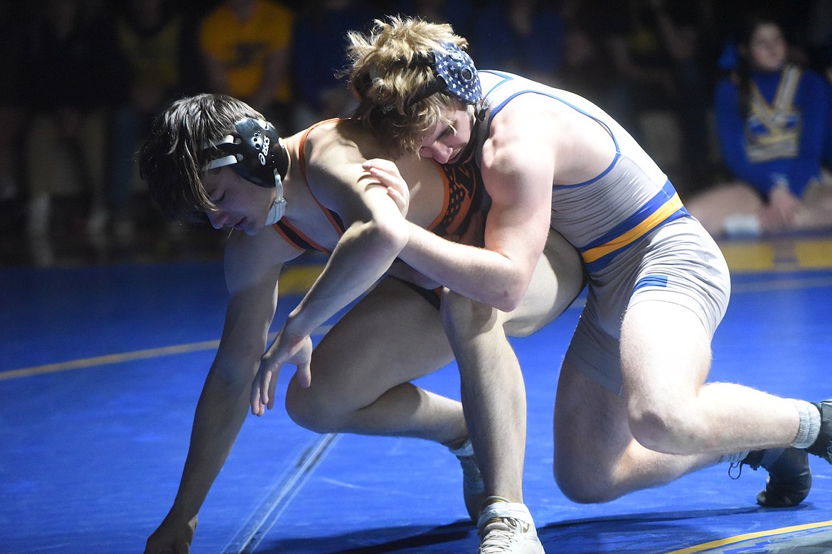 Libby's Joey Wise controls Eureka's Michael Watters in Tuesday's match at 152 pounds. (Scott Shindledecker/The Western News)