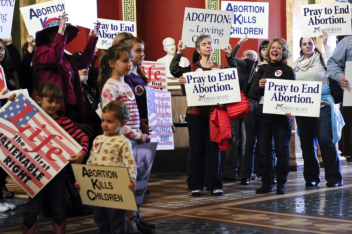 Protesters fill the Montana state Capitol rotunda in Helena, Mont., on Feb. 11, 2015, during a rally to show support in an attempt to change the Montana Constitution to define life as beginning at conception. (Thom Bridge/Independent Record via AP, File)