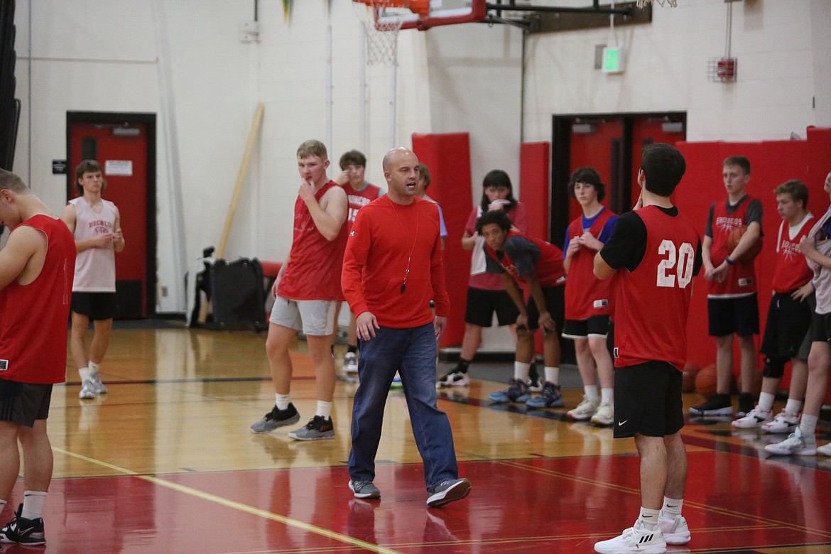 Lind-Ritzville Head Coach Dustan Arlt, pictured here talking with the team during practice, said that the Broncos have been battling fatigue with playing a jam-packed January schedule.