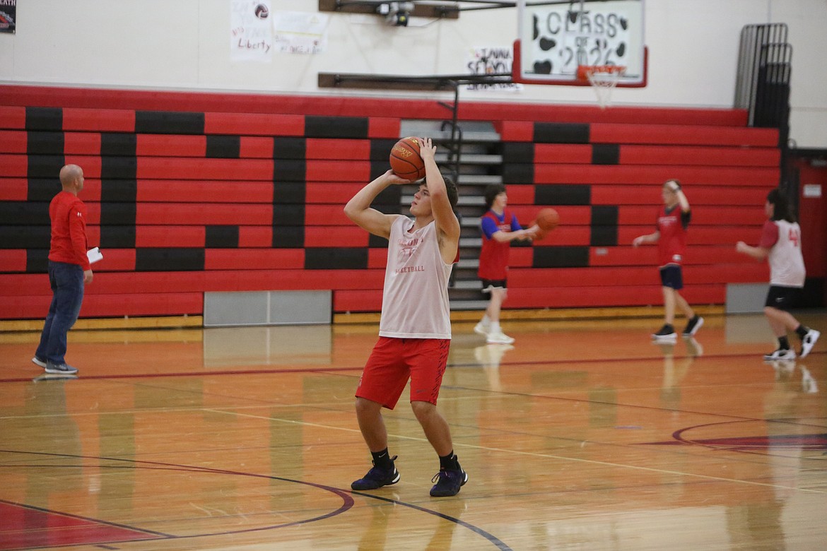 Lind-Ritzville senior Hunter Dinkins, pictured here shooting a three-pointer during practice, has been contributing more on offense for the Broncos over the past few games, according to Head Coach Dustan Arlt.