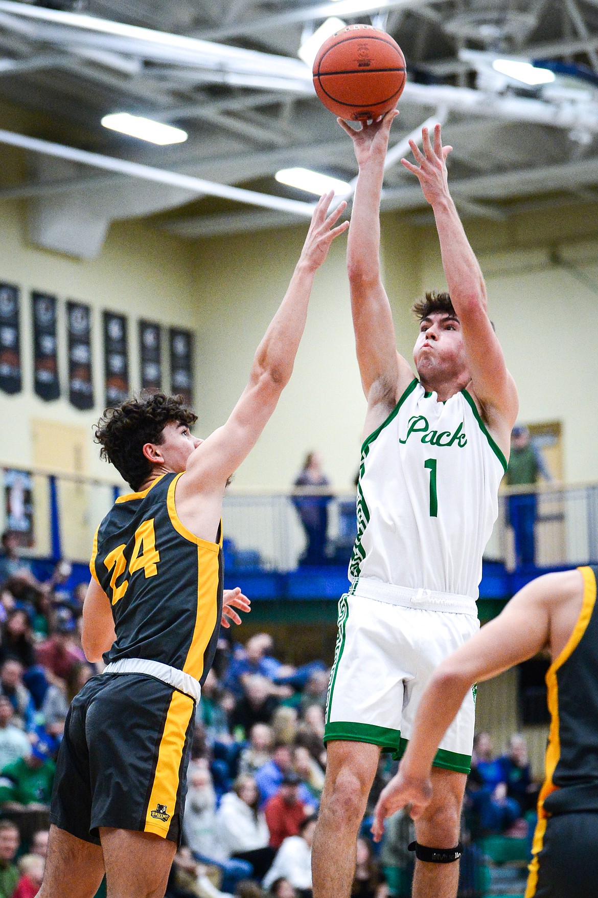 Glacier's Cohen Kastelitz (1) shoots over Helena Capital's Luke Dowdy (24) in the second quarter at Glacier High School on Friday, Jan. 13. (Casey Kreider/Daily Inter Lake)