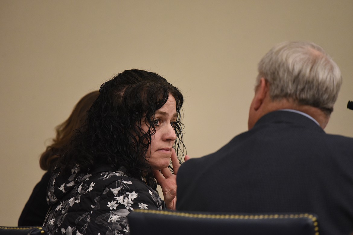 Amy Elizabeth Glanville speaks with defense attorney Lane Bennet at her sentencing on a felony theft charge in Flathead County District Court on Jan. 13. (Derrick Perkins/Daily Inter Lake)