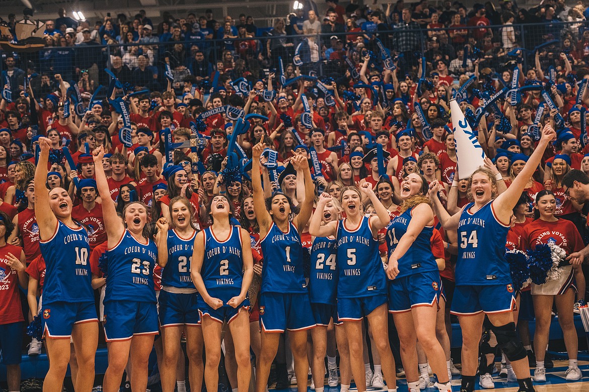 Courtesy of CHRISTINE WOELLER
Members of the Coeur d'Alene girls basketball team celebrate with their fans following Friday's 54-41 Inland Empire League win over Lake City at Viking Court.