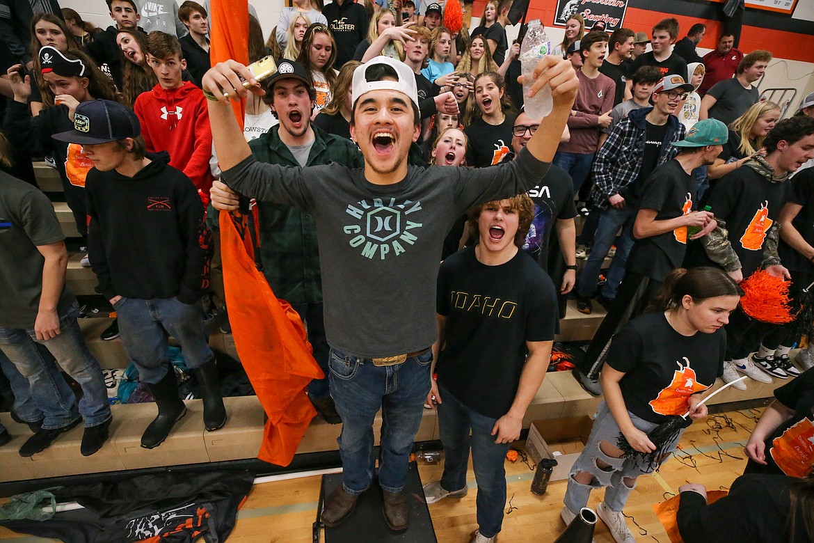 A group of Priest River fans, led by Shayd Wong-Yuen, cheers on the Spartans during Thursday's Battle of the Border between Priest River and Newport high schools.