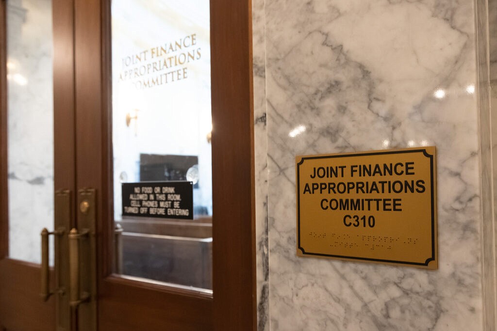 Members of the Senate Finance Committee and the House Appropriations Committee meet nearly every day during the legislative session as the Joint Finance-Appropriations Committee to hear proposals and set the state’s budgets. They meet in this room at the Idaho Capitol. (Otto Kitsinger for Idaho Capital Sun)