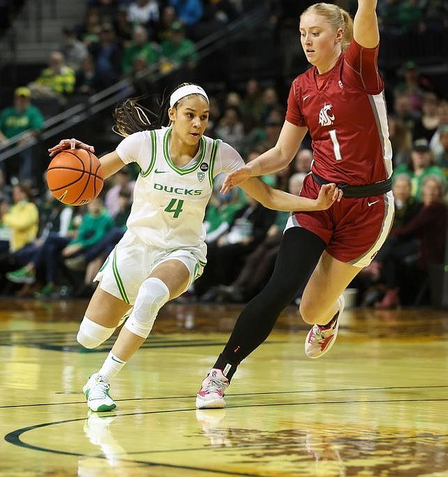 ERIC EVANS/GoDucks.com
Tara Wallack (1) of Washington State defends as Endyia Rogers (4) of Oregon drives to the basket on Sunday in Eugene, Ore.