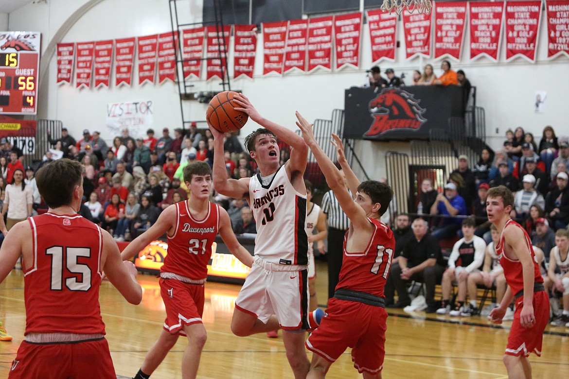 Lind-Ritzville/Sprague sophomore Jayce Kelly shoots a turnaround jumper in the second half of the Bronco’s 60-48 loss to Davenport on Saturday.