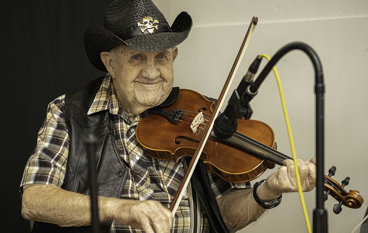 Bob Sink, 90, plays the fiddle at a celebration at Whitepine Grange. (Tracy Scott/Valley Press)