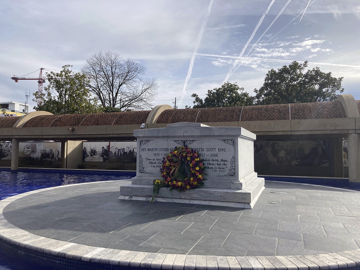 The tomb of Martin Luther King Jr. is pictured at Martin Luther King Jr. National Historical Park in Atlanta, Monday, Jan. 16, 2023, where hundreds of people gathered to commemorate the federal holiday honoring the slain civil rights leader. King was assassinated in 1968 and now is entombed alongside his wife, Coretta Scott King, on the campus that includes the old Ebenezer Baptist Church where he once preached, the church's new sanctuary and The King Center that seeks to carry on his work for nonviolent social action. (AP Photo/Bill Barrow)