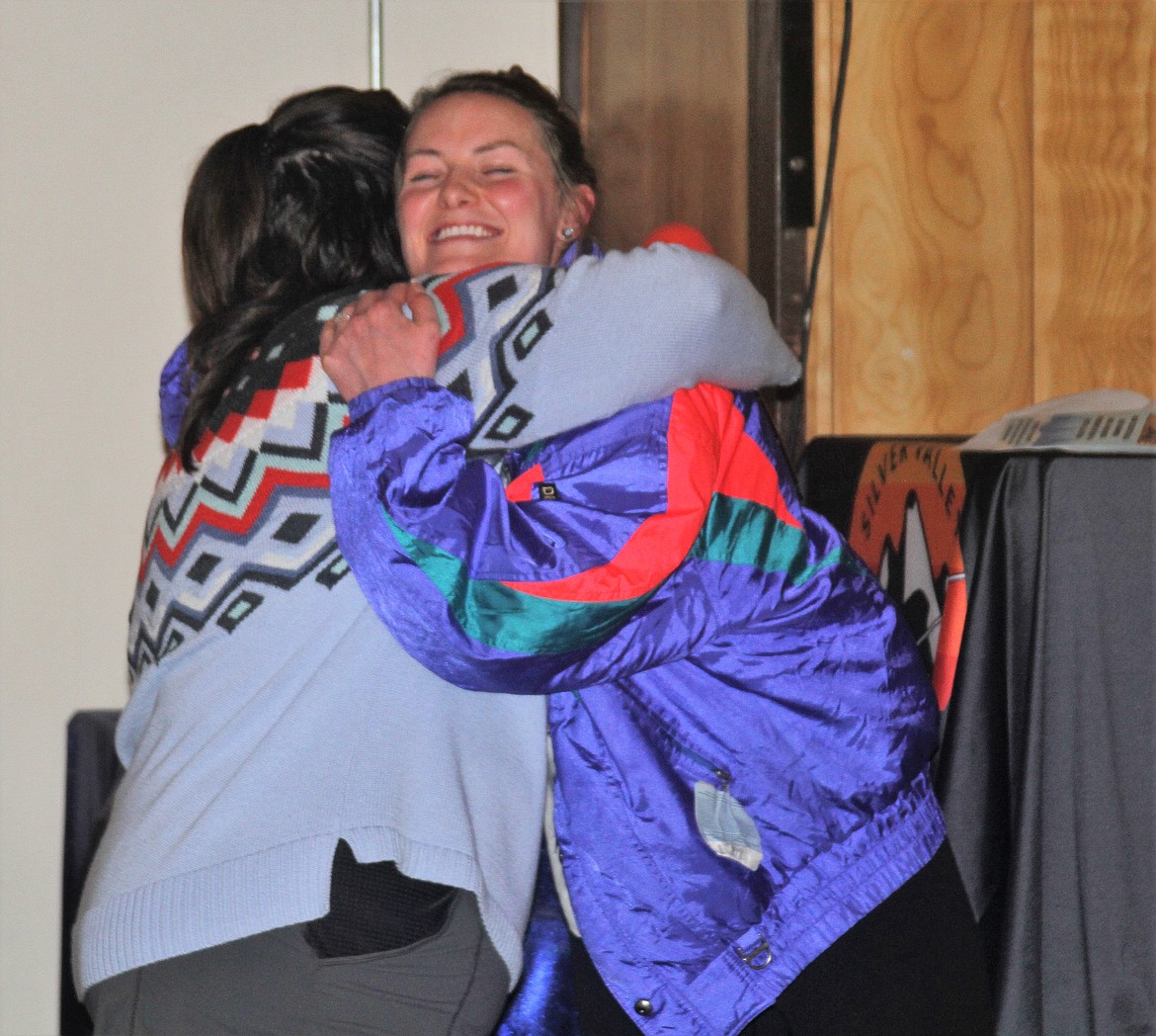 Tara Lodi hugs Kelton Enich after presented her with the Precious Gem Award.