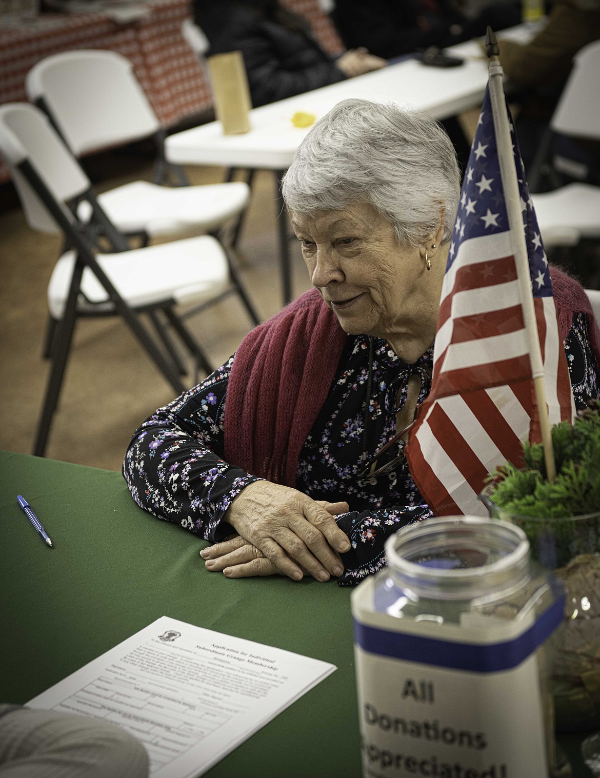 Kathy Hill keeps track of donations at the Whitepine Grange. (Tracy Scott/Valley Press)
