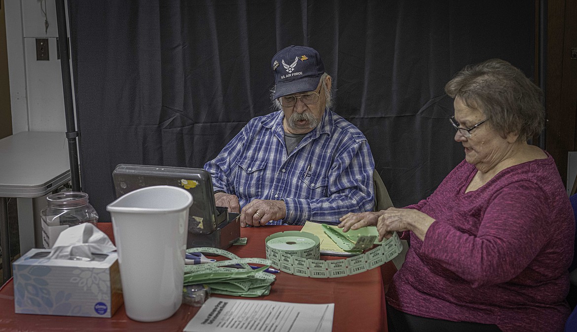 Ruth and Will Tucker helping out with raffle sales. (Tracy Scott/Valley Press)