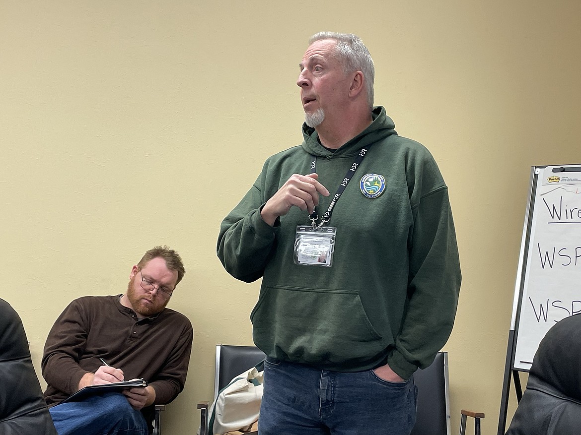 Washington State Department of Fish and Wildlife warm-water fish biologist Marc Peterson presents information on Moses Lake fish counts gathered from surveys of anglers on the lake as well as department netting on walleye in October 2020 to members of the Moses Lake Watershed Council on Tuesday. Elliott DeLong, the operations manager for the Columbia Basin Conservation District, is sitting behind him.