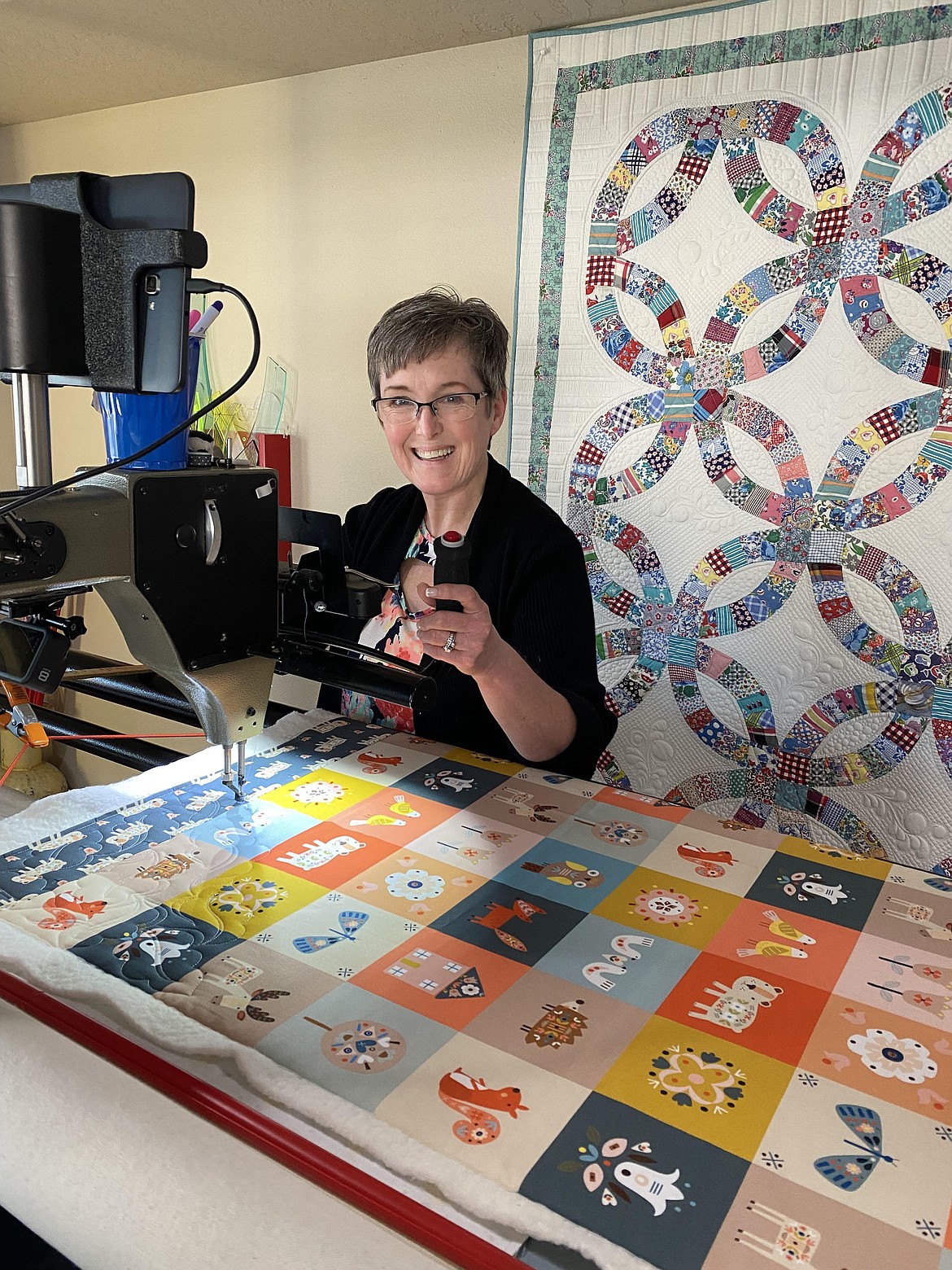 Pris Phillips pays to have her baby quilts long-arm quilted by Susan Smith (pictured) before they are donated to the Kootenai Health Neonatal Intensive Care Unit. Wee Ones Quilts was established by Phillips to give baby blankets to patients in the NICU.