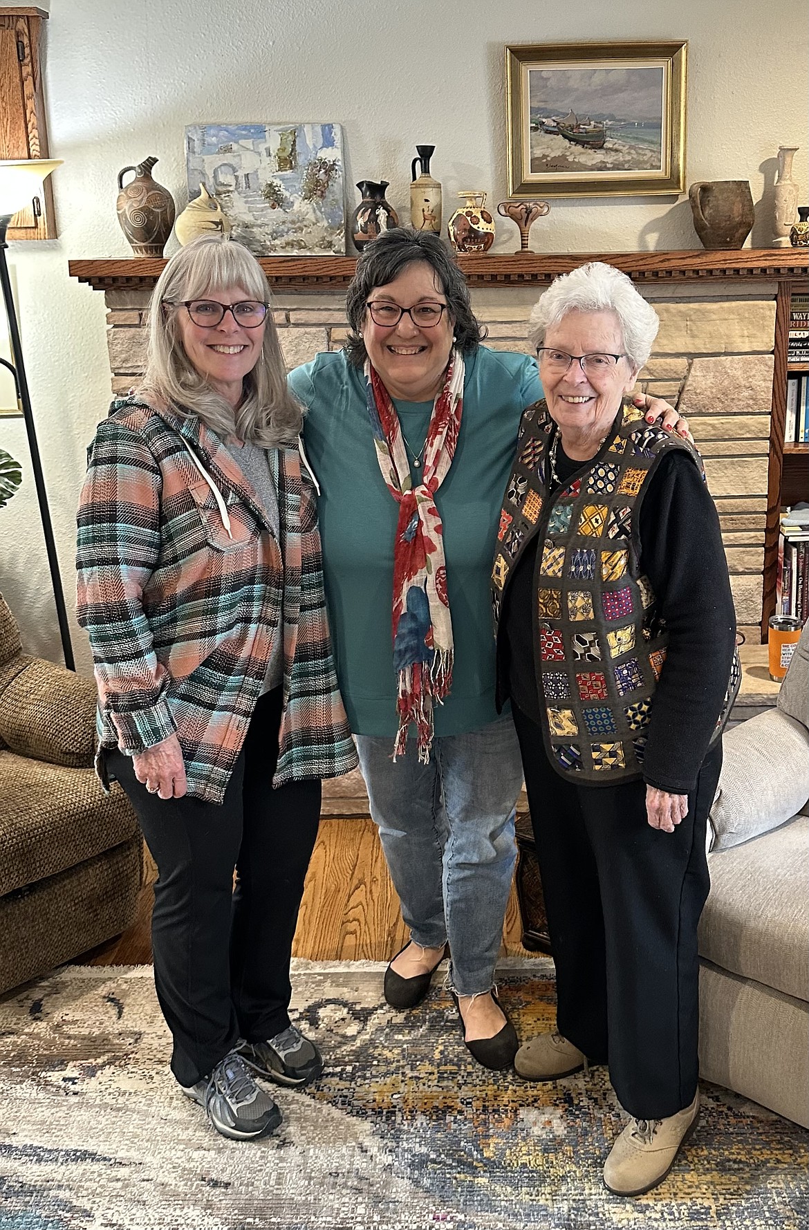 From left, Alesa Momerak, Pris Phillips and Ginger Hain pose for a photo celebrating their work with Wee Ones Quilts. Phillips formed the group to donate blankets to the neonatal intensive care unit at Kootenai Health.