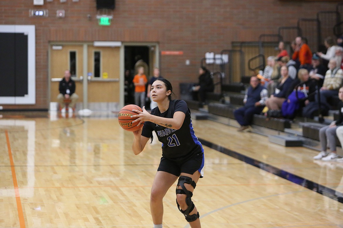 Warden senior Jlynn Rios attempts a three-pointer against Cashmere on Nov. 29, 2022.