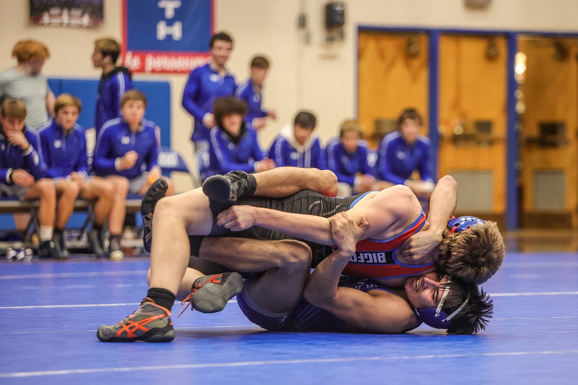 Treysen Torpen pins his opponent in Columbia Falls in the duel against Bigfork. (JP Edge photo)