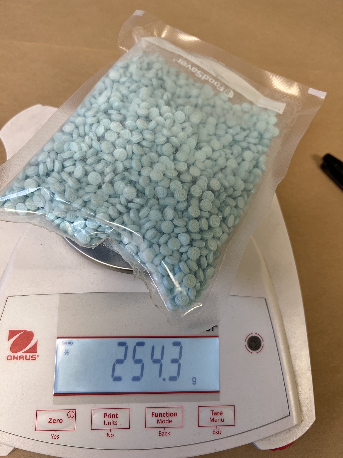 The half-pound of fentanyl – around 3,000 pills – seized by Moses Lake Police Department officers following the arrest of Dustin Duville on Saturday. Methamphetamine, powdered fentanyl and at least one reportedly stolen motorcycle were also found in the investigation.