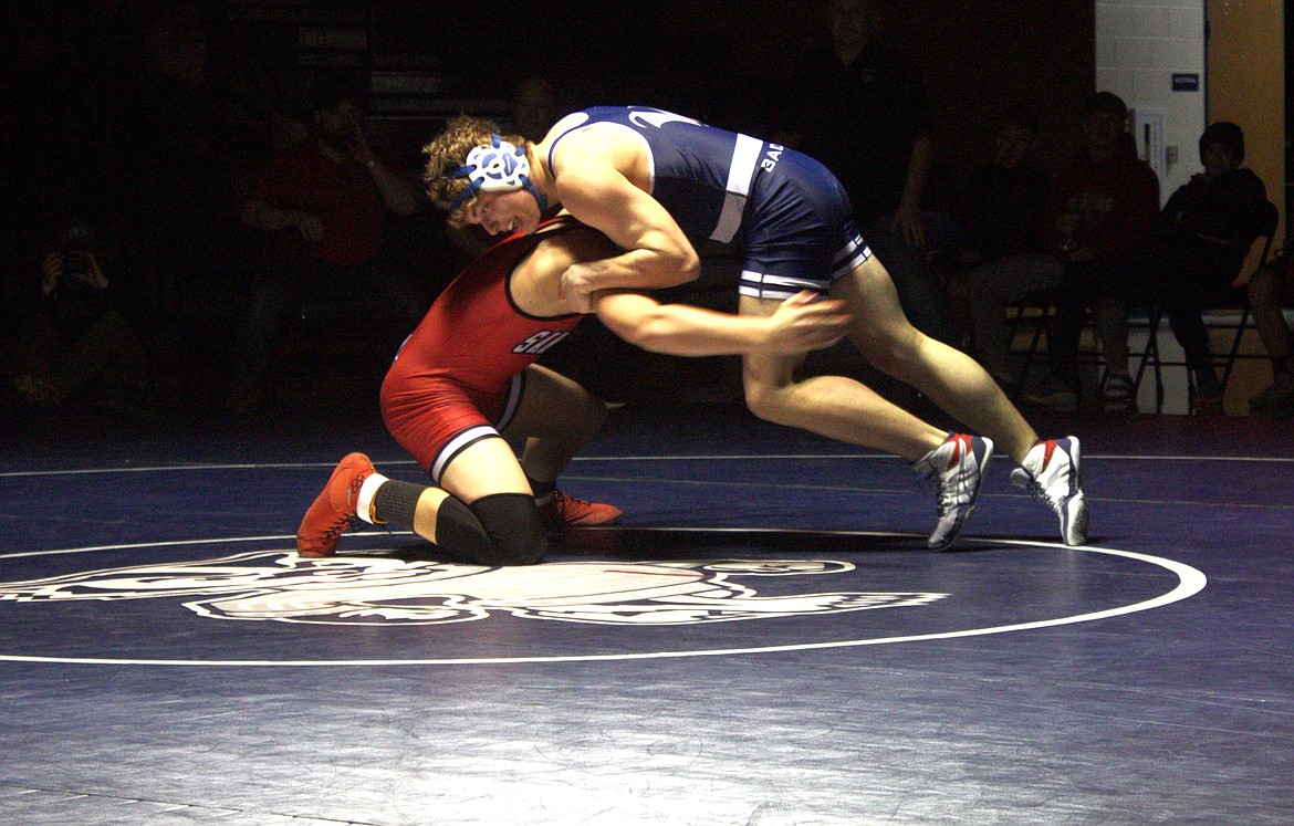 Jackson Holman battles it out against his Sandpoint opponent at the B-Cup on Jan. 17.