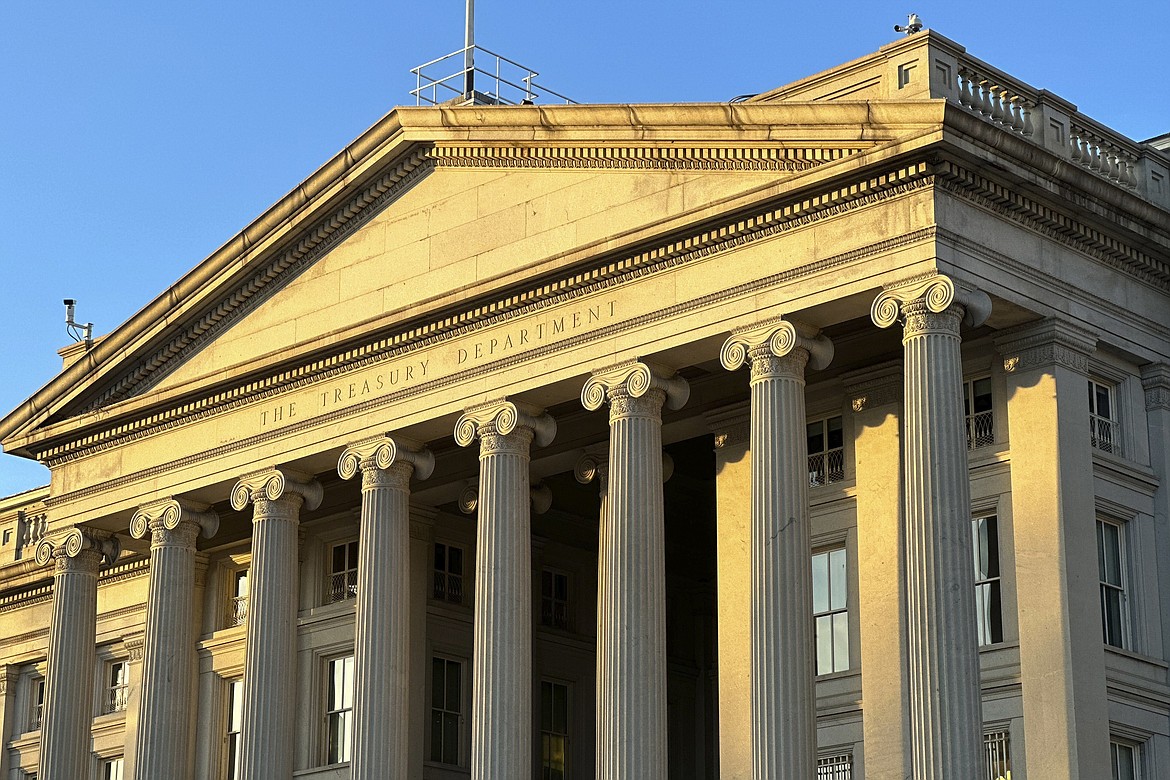 The Treasury Department is seen near sunset in Washington, Wednesday, Jan. 18, 2023. The Treasury Department projects that the federal government on Thursday will reach its legal borrowing capacity, an artificially imposed cap that lawmakers have increased roughly 80 times since the 1960s. Markets so far remain calm, as the government can temporarily rely on accounting tweaks to stay open. (AP Photo/Jon Elswick)