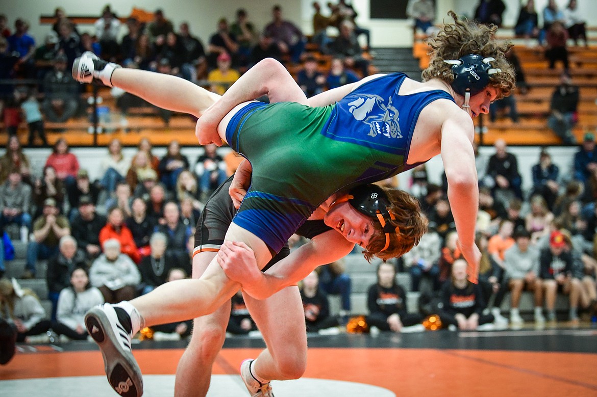 Flathead's Logan Stansberry takes Glacier's Korbin Baldwin to the mat at 145 pounds during crosstown wrestling at Flathead High School on Thursday, Jan. 19. Stansberry won by pin.(Casey Kreider/Daily Inter Lake)